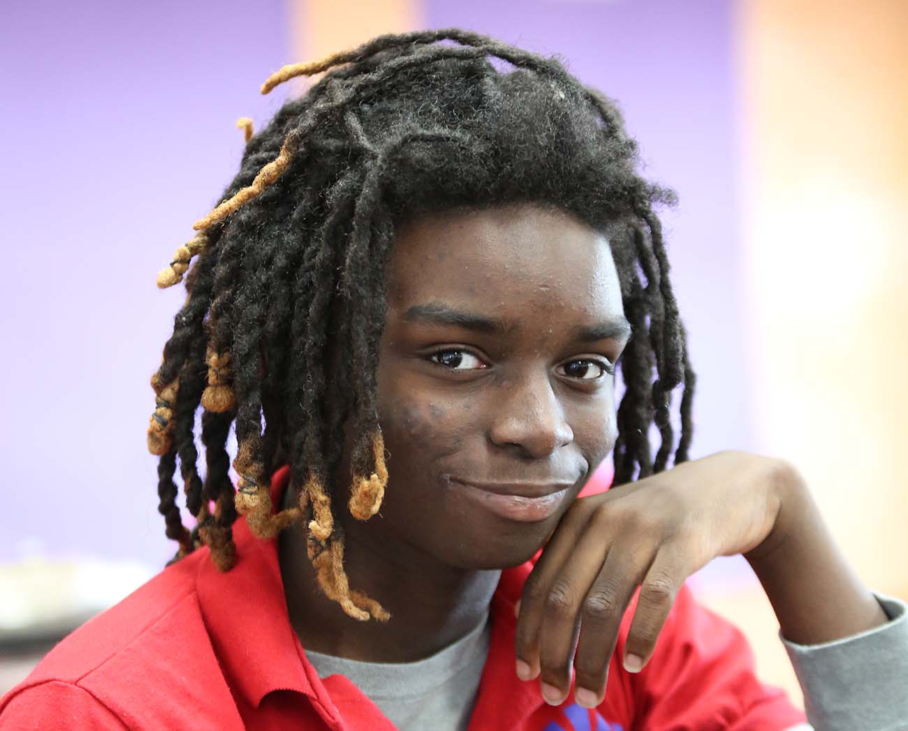 Smiling children together outdoors.